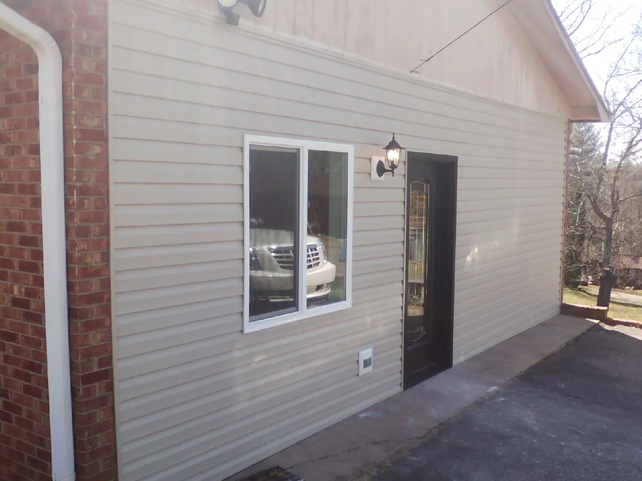 New vinyl siding and entry door on a room addition in Slingerlands
